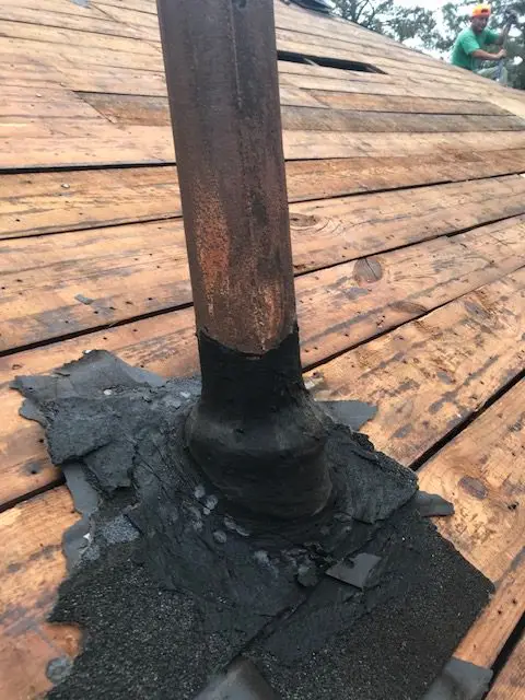 degraded roof pipe collars on a roof